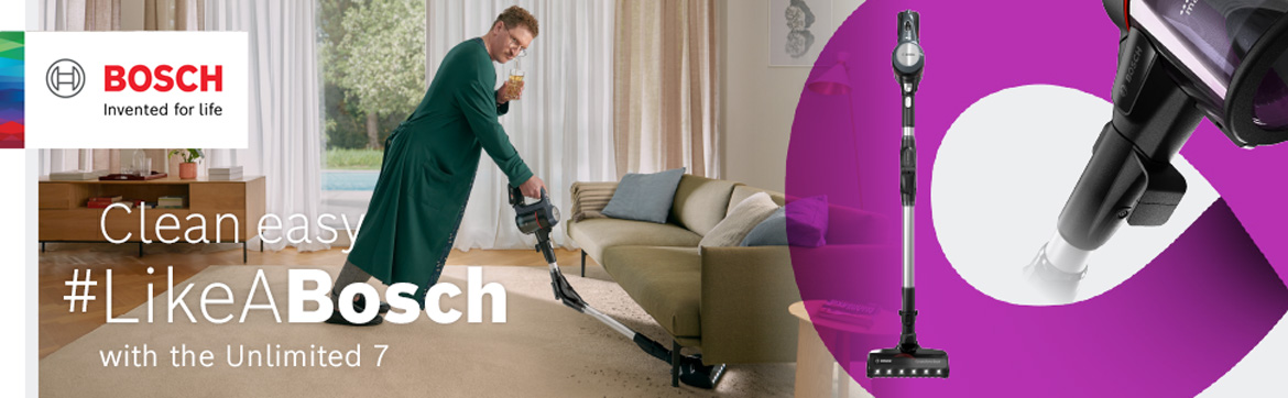 A man vacuums his carpet