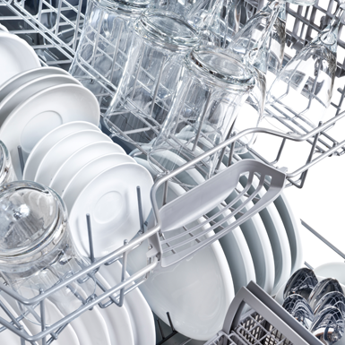 Dishwasher full of cutlery and utensils